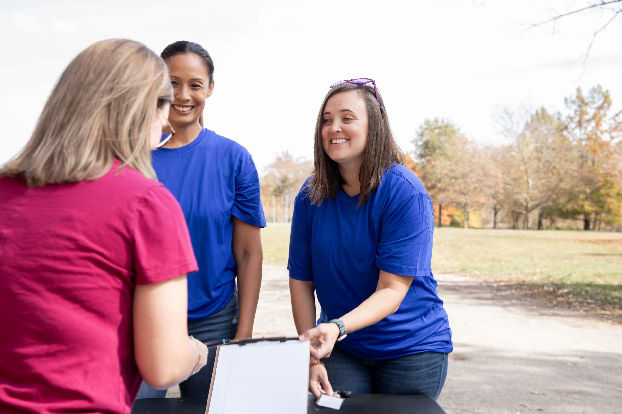 Community members signing up at a charity volunteer drive