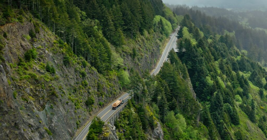 Aerial Wide Shot of Winding Mountain Road on Oregon Coast