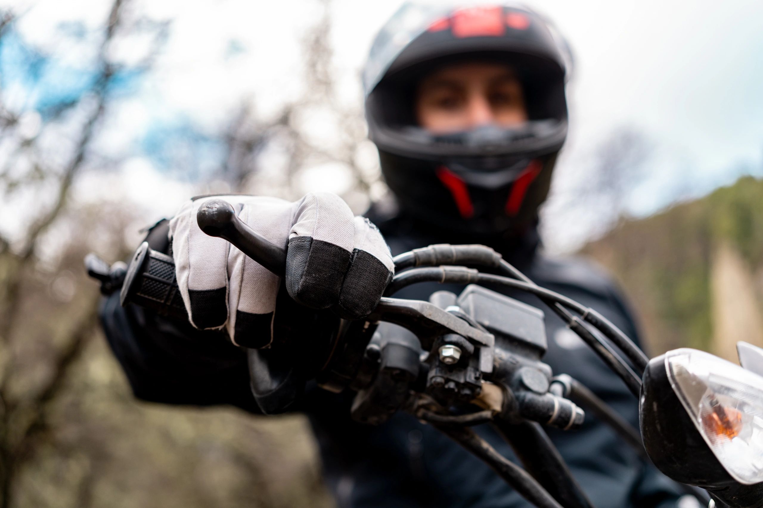 Close-up of a motorcyclist riding, representing solidarity and action